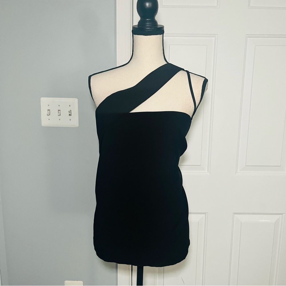 Brand new, black top with asymmetric straps.